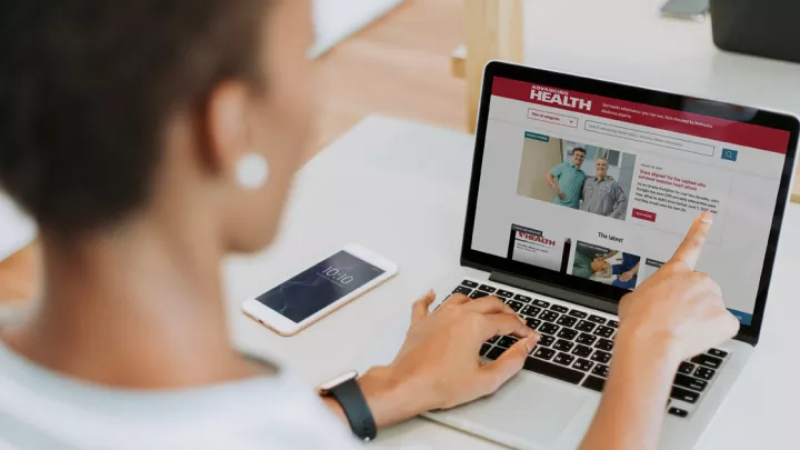 Woman looking at NebraskaMed.com on laptop