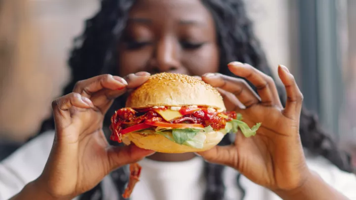 Woman holding burger