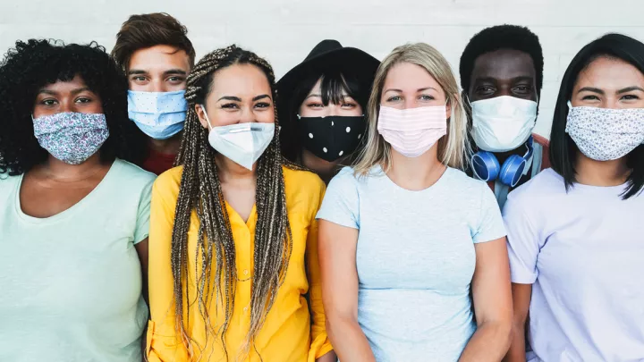 picture of a group of young adults in face masks