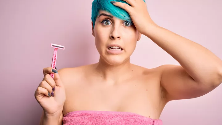 Funny picture of woman holding a razor