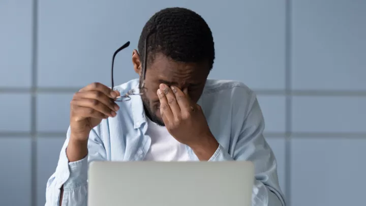 Man rubbing his eyes