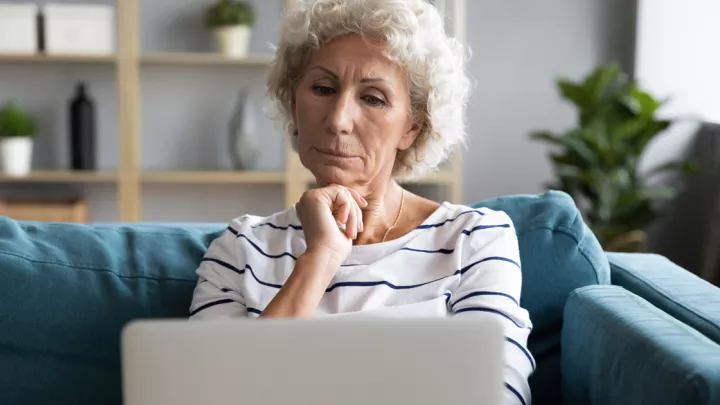 Older woman looking at laptop