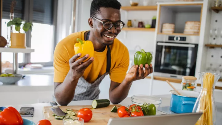 Man holding bell peppers