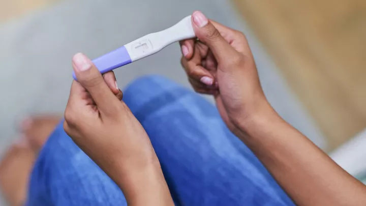 Home pregnancy test being held