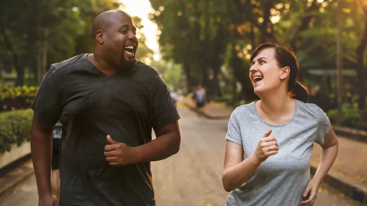 A man and a woman on a run together