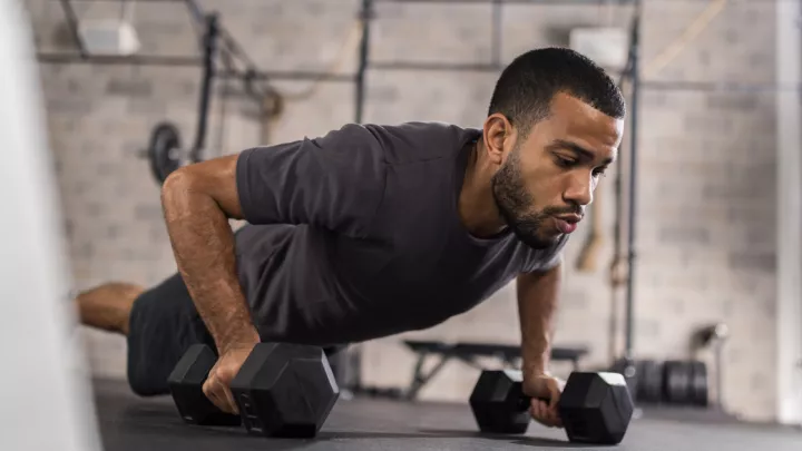 Man doing pushups with weights