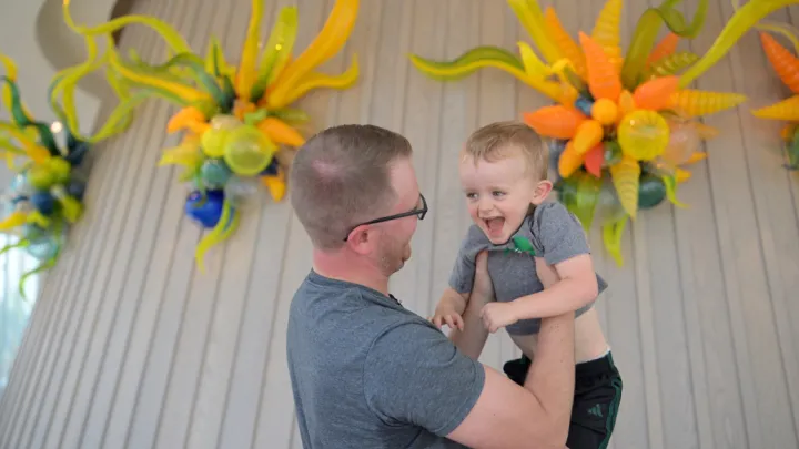 Dan Petersen holding son Jack