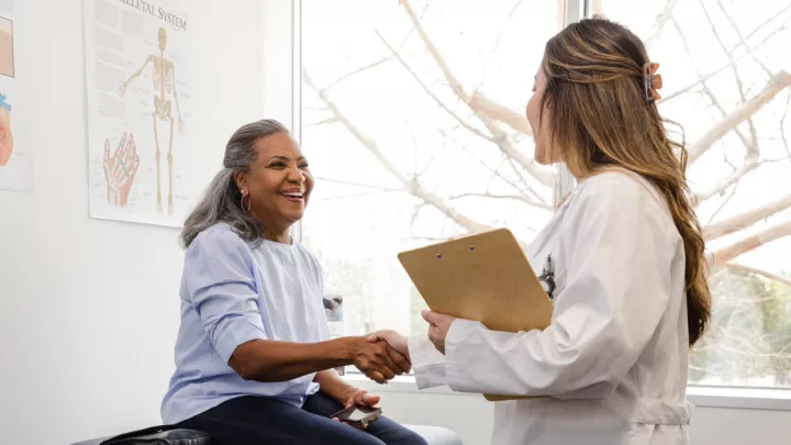 Older woman talking to her doctor