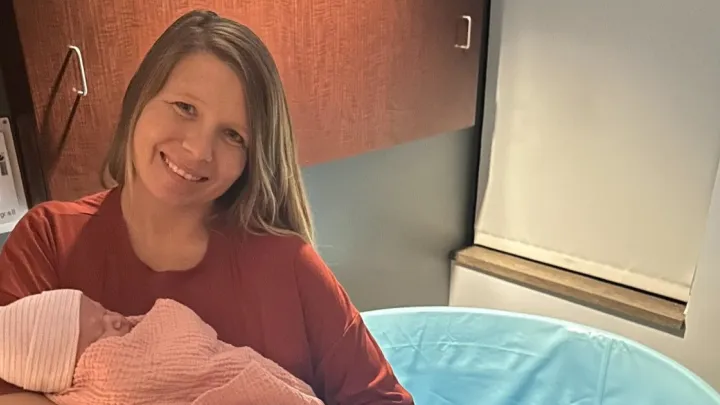 Brittany Catton holding newborn daughter Scarlett