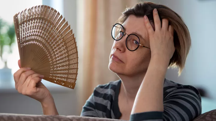 woman with hand fan