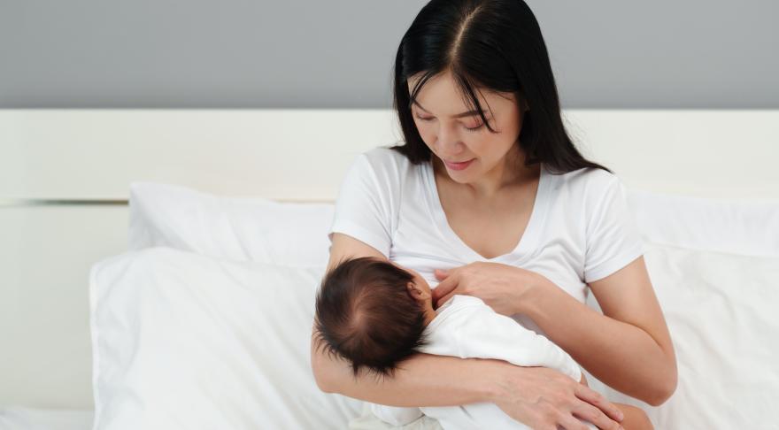 A mother breast feeding her child