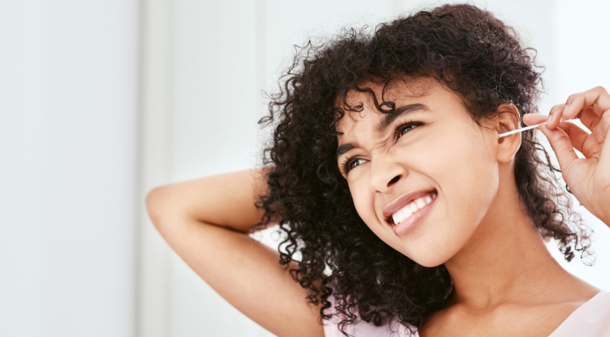 Woman cleaning ears with q-tip